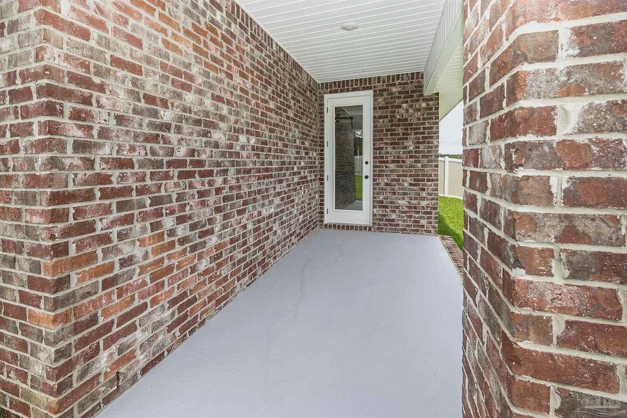 Exterior details and patio area of a home in Parkland Place, Pace (Image 19).