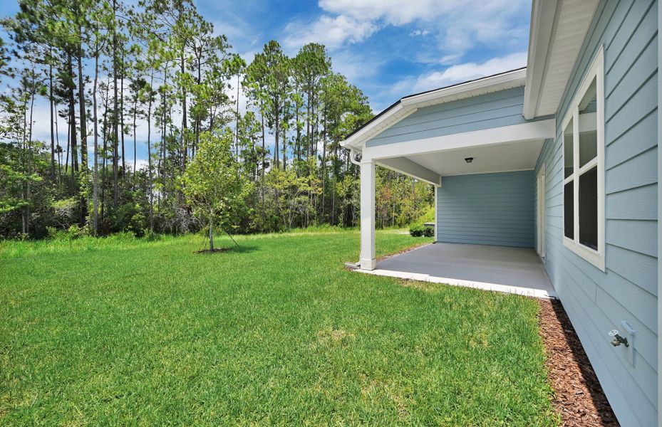 Exterior details and patio area of a home in Fiddler's Cove, Kingsland (Image 3).