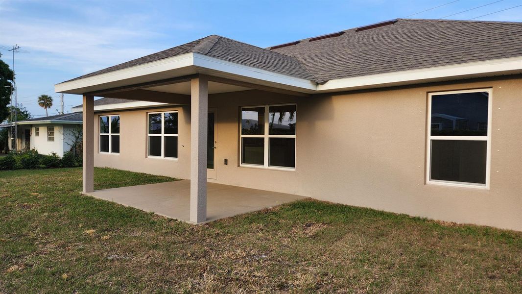 Front exterior of a new home in Gatlin, Port St. Lucie, FL, highlighting curb appeal (Image 16).