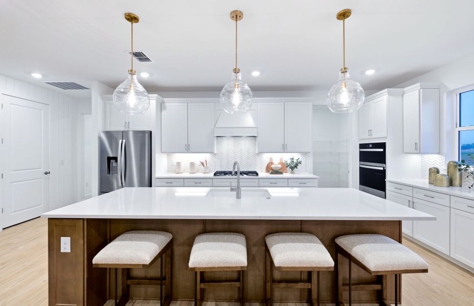 Representative furnished interior of a home built from the Palmary by DiVosta in BeachWalk by Manasota Key, Englewood (Image 7).
