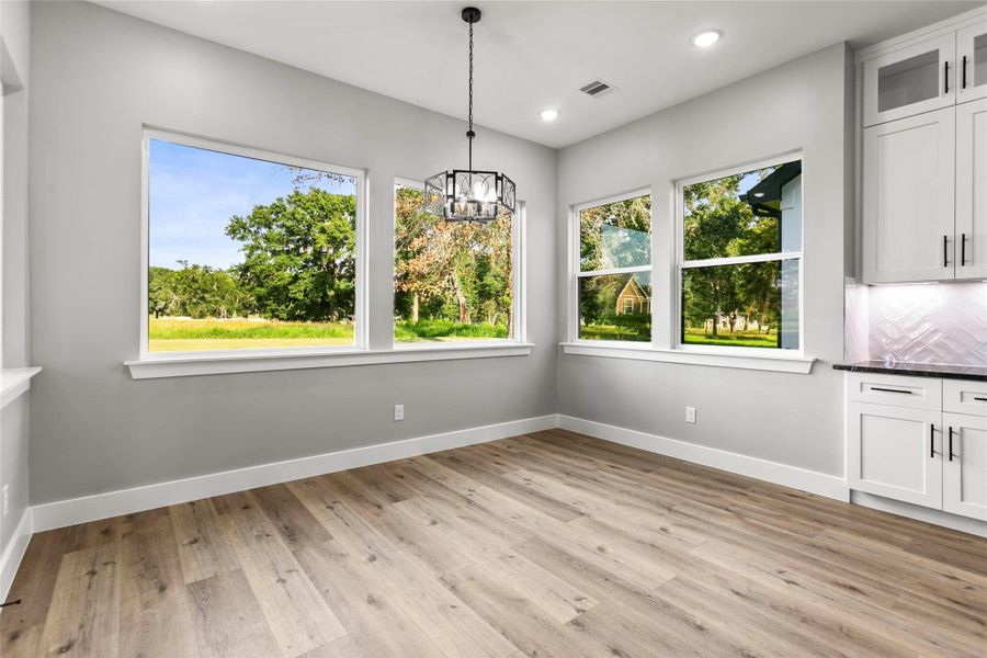The dining and breakfast area looks out onto the quiet, and large, backyard. The dining and breakfast area looks out onto the quiet, and large, backyard.