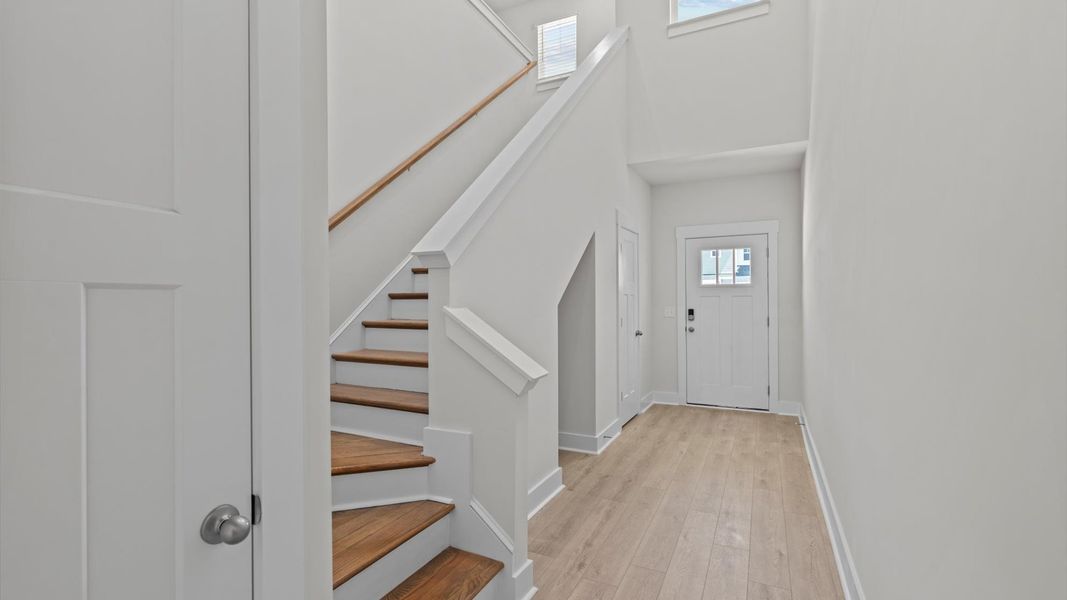 Superior design begins at the front door with a hardwood floor foyer and elegant sightlines Superior design begins at the front door with a hardwood floor foyer and elegant sightlines