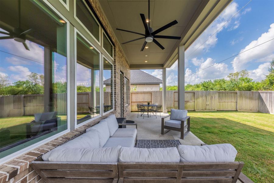Oversized covered patio extends the home’s living space outdoors with recessed lighting and an impressive ceiling fan. It’s an inviting setting for alfresco dining, entertaining or relaxing while enjoying the greenbelt views. Oversized covered patio extends the home’s living space outdoors with recessed lighting and an impressive ceiling fan. It’s an inviting setting for alfresco dining, entertaining or relaxing while enjoying the greenbelt views.