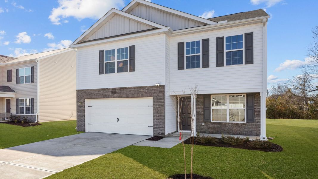 Front exterior of a new home in Madeline Farm, New Bern, NC, highlighting curb appeal (Image 23). Front exterior of a new home in Madeline Farm, New Bern, NC, highlighting curb appeal (Image 23).
