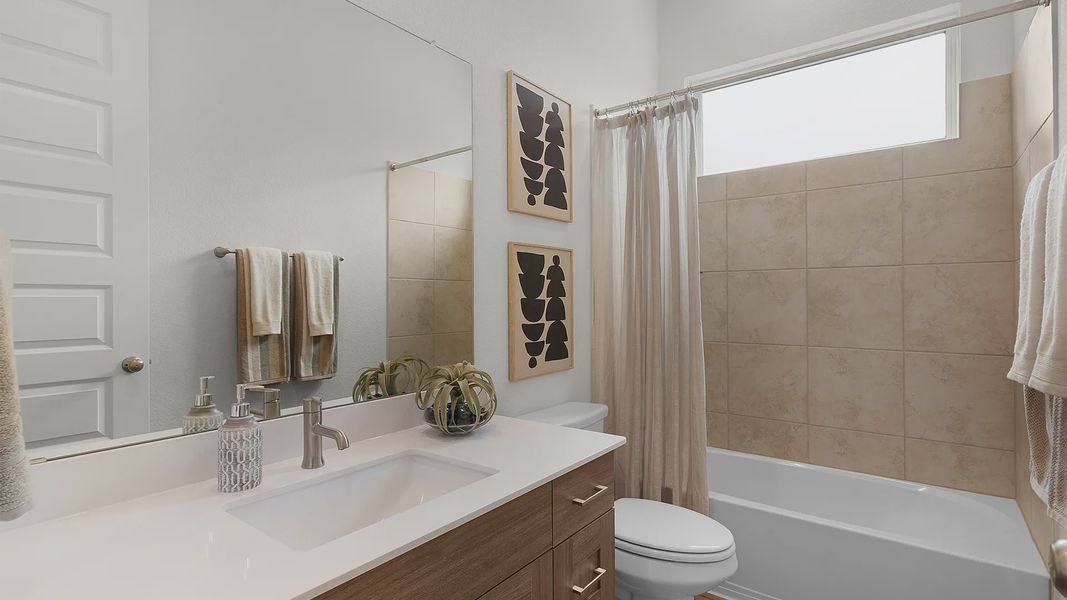 Representative furnished interior of a home built from the Maddy by Chesmar Homes in The Grove at Blackhawk, Pflugerville (Image 8). Representative furnished interior of a home built from the Maddy by Chesmar Homes in The Grove at Blackhawk, Pflugerville (Image 8).