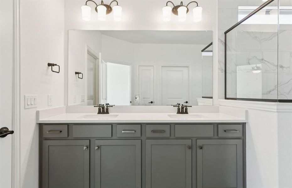 Owner's bathroom features double vanity and large shower