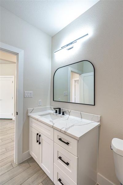 Bathroom featuring toilet and vanity