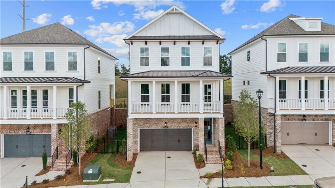 Front exterior of a new home in Palisades Single Family, Cumming, GA, highlighting curb appeal (Image 22).