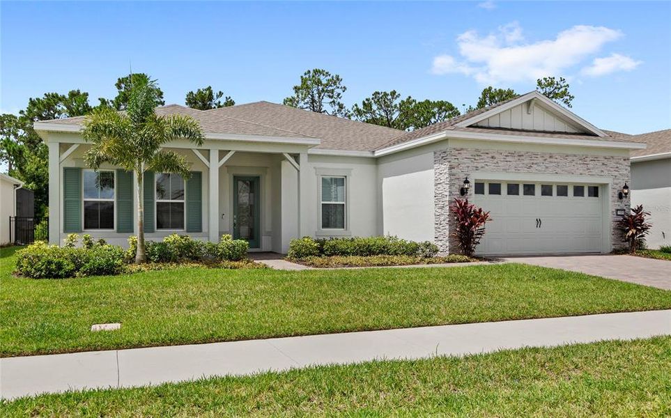 Front exterior of a new home in , Winter Garden, FL, highlighting curb appeal (Image 25). Front exterior of a new home in , Winter Garden, FL, highlighting curb appeal (Image 25).