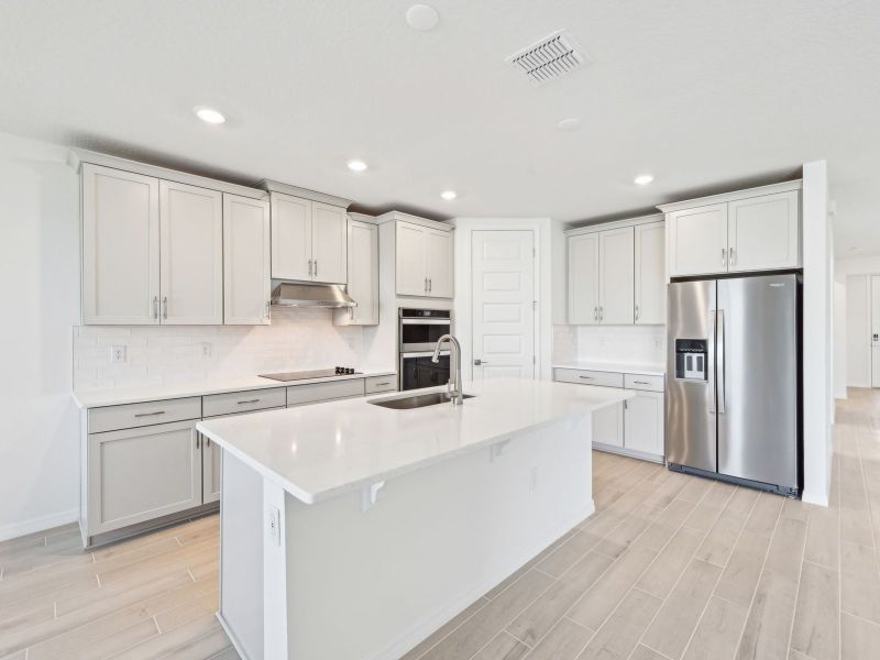 Furnished interior view inside a new home in Oakfield Trails - Signature Series, Parrish (Image 3).