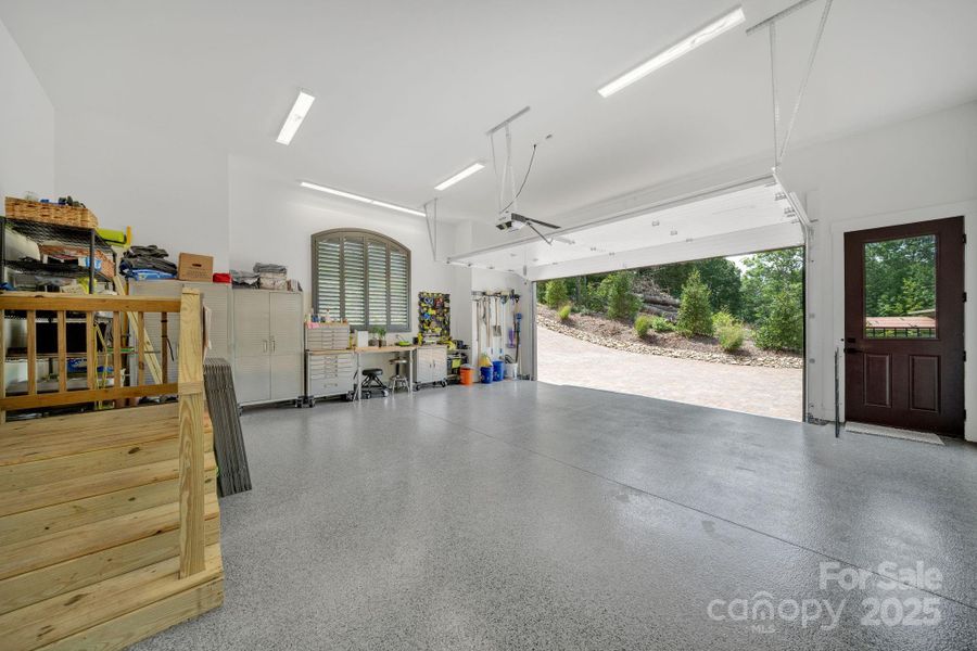 2 car garage w/ epoxy floors & fenced dog run entrance