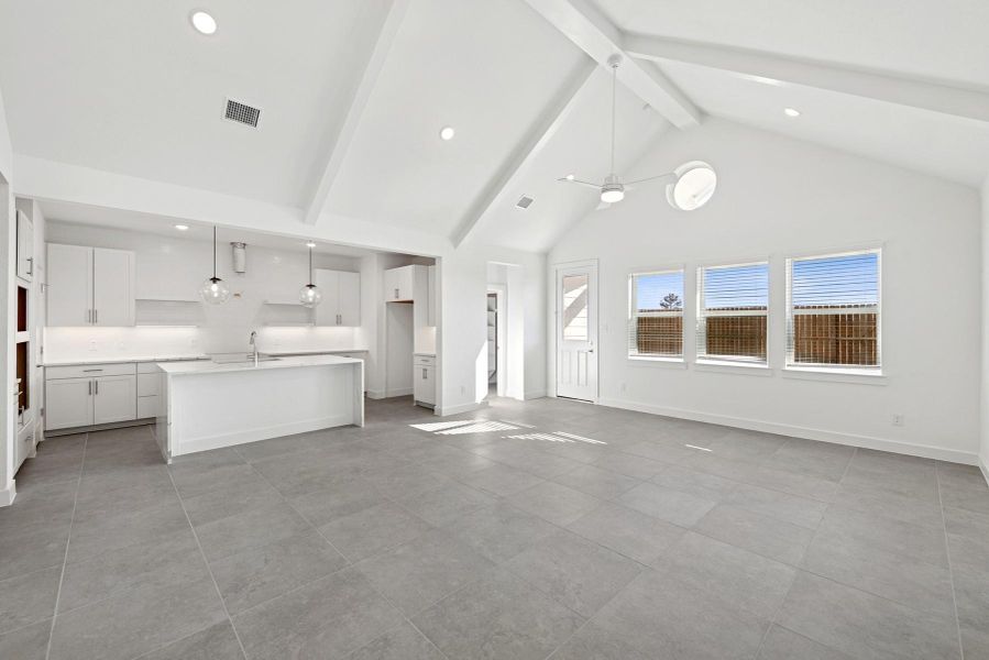 Open living area with high vaulted ceilings