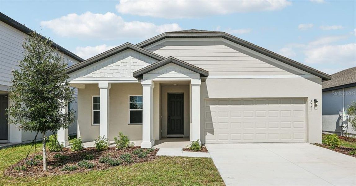Front exterior of a new home in Sunbrooke, St. Cloud, FL, highlighting curb appeal (Image 2). Front exterior of a new home in Sunbrooke, St. Cloud, FL, highlighting curb appeal (Image 2).