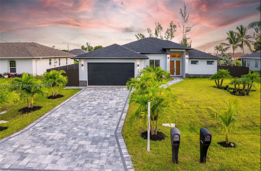 Front exterior of a new home in , Cape Coral, FL, highlighting curb appeal (Image 23).
