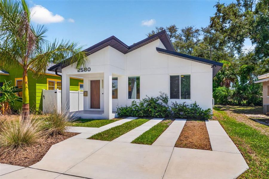 Front exterior of a new home in , St. Petersburg, FL, highlighting curb appeal (Image 2). Front exterior of a new home in , St. Petersburg, FL, highlighting curb appeal (Image 2).