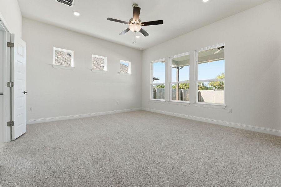 Unfurnished room with light carpet, ceiling fan, and recessed lighting