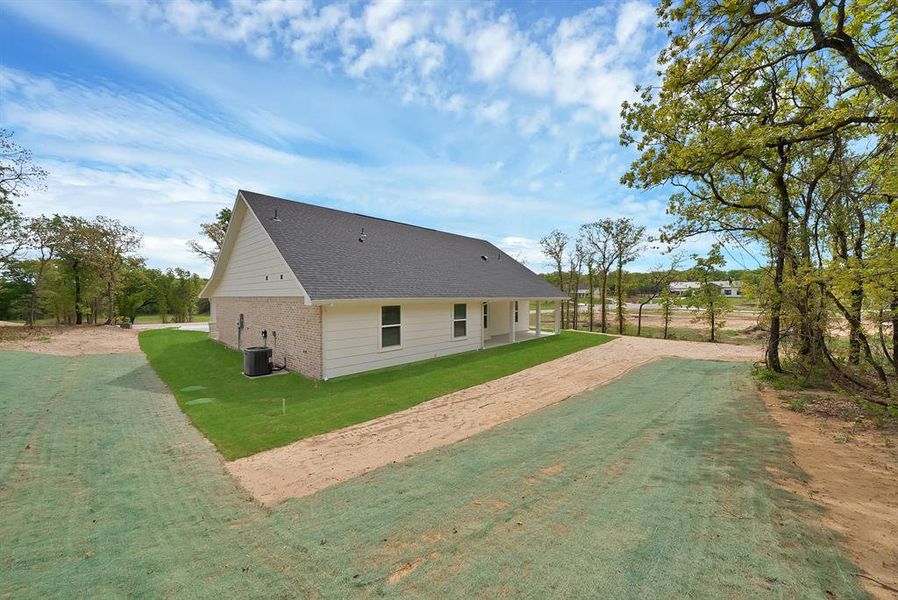 Exterior details and patio area of a home in , Poolville (Image 3).