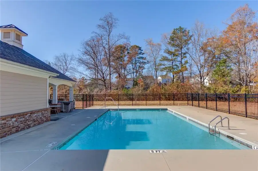 Exterior details and patio area of a home in Cambridge, Flowery Branch (Image 3).