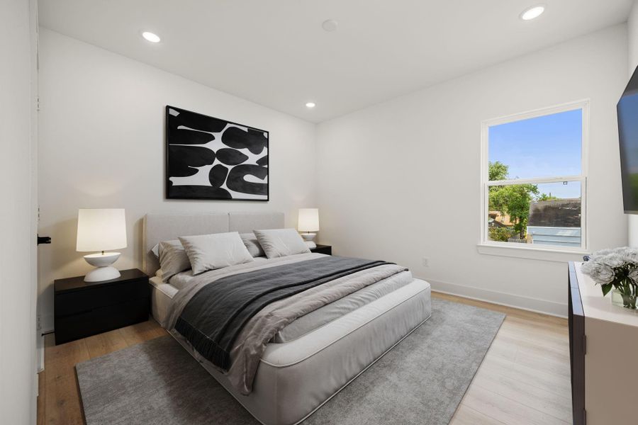 Secondary bedroom features wood like vinyl flooring, neutral paint and a large window allowing in natural light. Secondary bedroom features wood like vinyl flooring, neutral paint and a large window allowing in natural light.