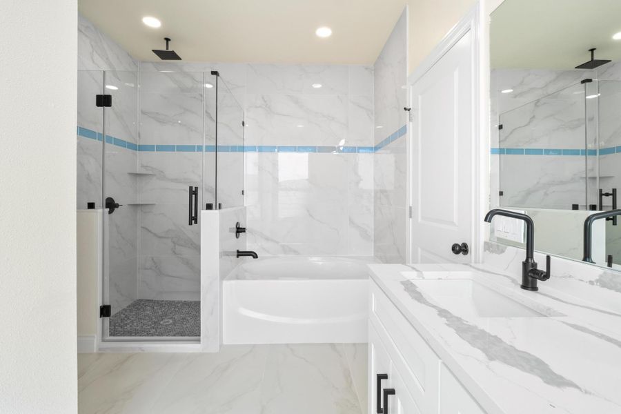Bathroom featuring a garden tub, vanity, recessed lighting, marble finish floor, and a marble finish shower