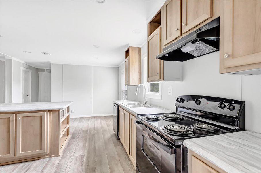 Kitchen with island and matching appliances new as of 2024