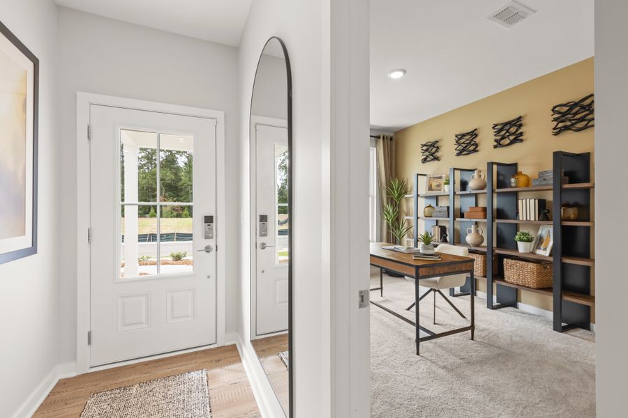 A room with a table and shelves.