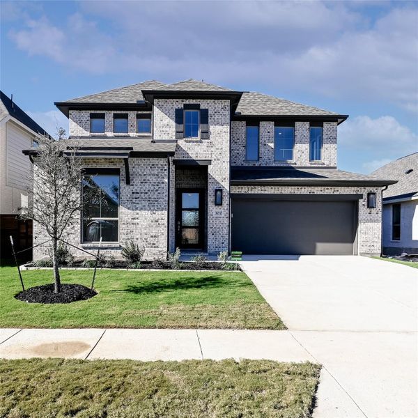 Front exterior of a new home in Juniper Springs, Lockhart, TX, highlighting curb appeal (Image 23).