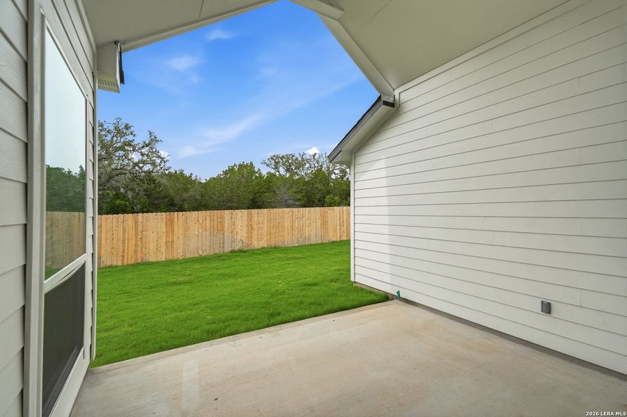 Exterior details and patio area of a home in The Reserve at Potranco Oaks, Castroville (Image 26).