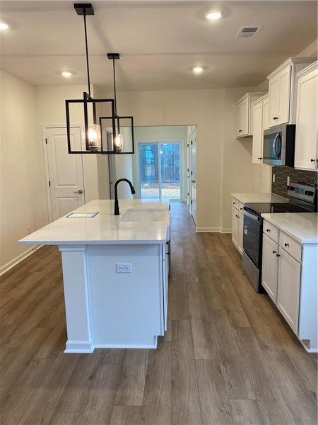 Furnished interior view inside a new home in Springwood Grove, Central (Image 3).