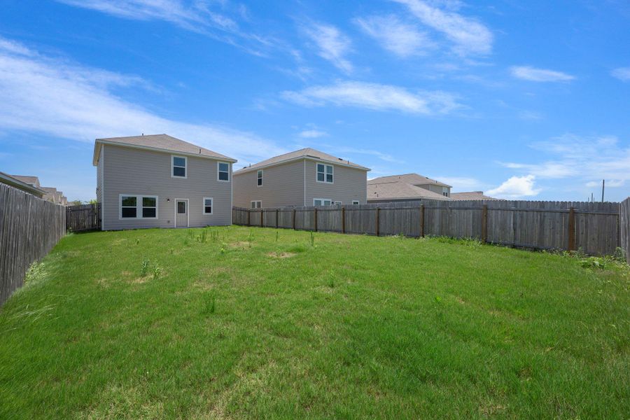 Front exterior of a new home in Cottonwood Farms, Hutto, TX, highlighting curb appeal (Image 20). Front exterior of a new home in Cottonwood Farms, Hutto, TX, highlighting curb appeal (Image 20).