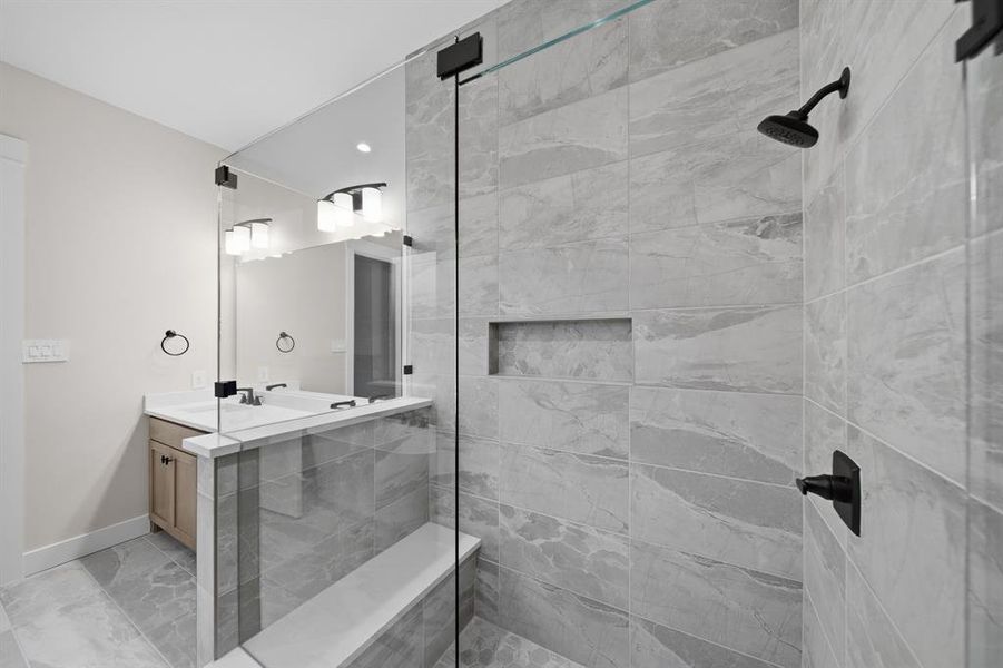 Full bath with a stall shower and vanity