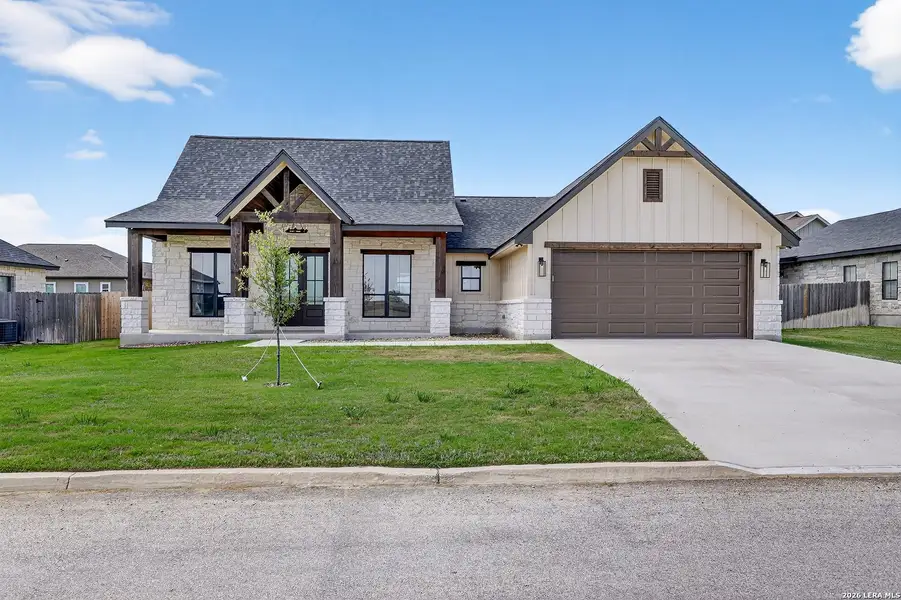 Front exterior of a new home in , Poth, TX, highlighting curb appeal (Image 25).