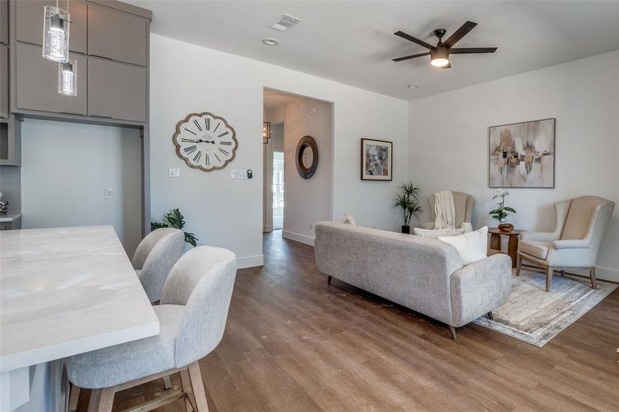 Living room featuring hardwood / wood-style floors and ceiling fan