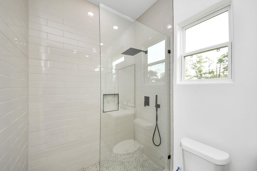 Secondary bathroom offers large walk in shower. Secondary bathroom offers large walk in shower.