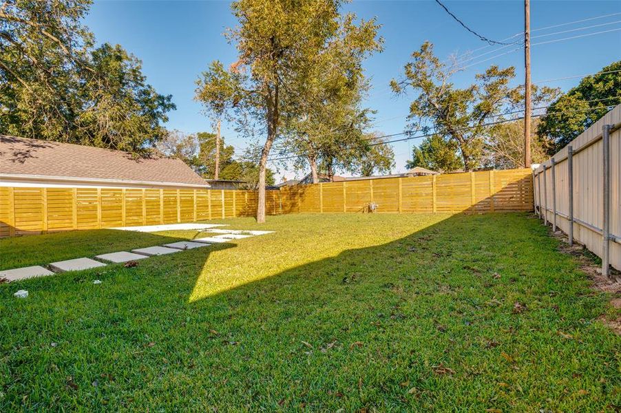 View of fenced backyard