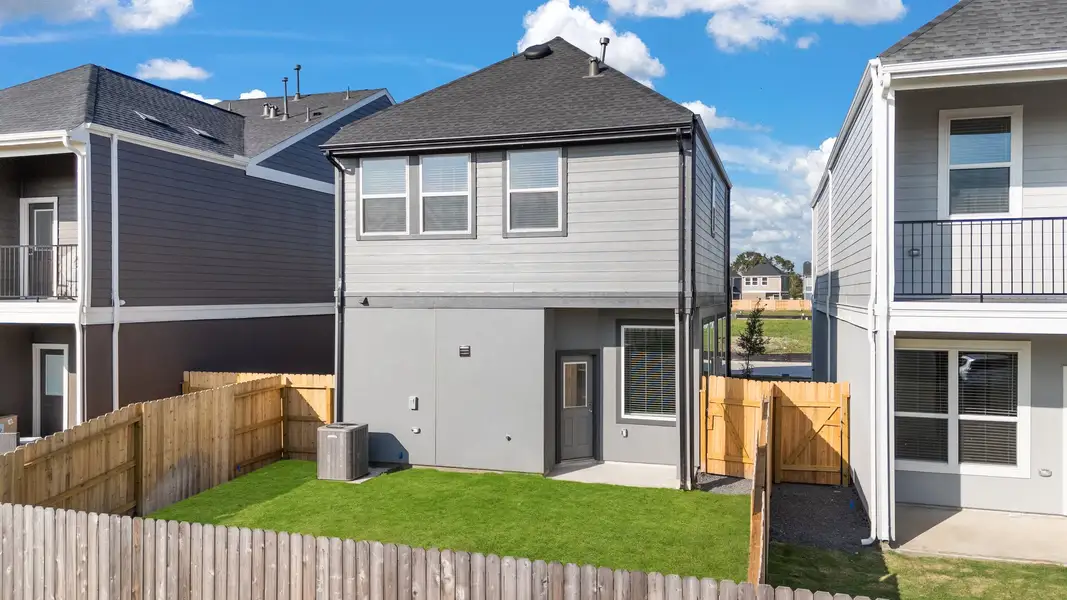 Exterior details and patio area of a home in Meridiana, Manvel (Image 4).