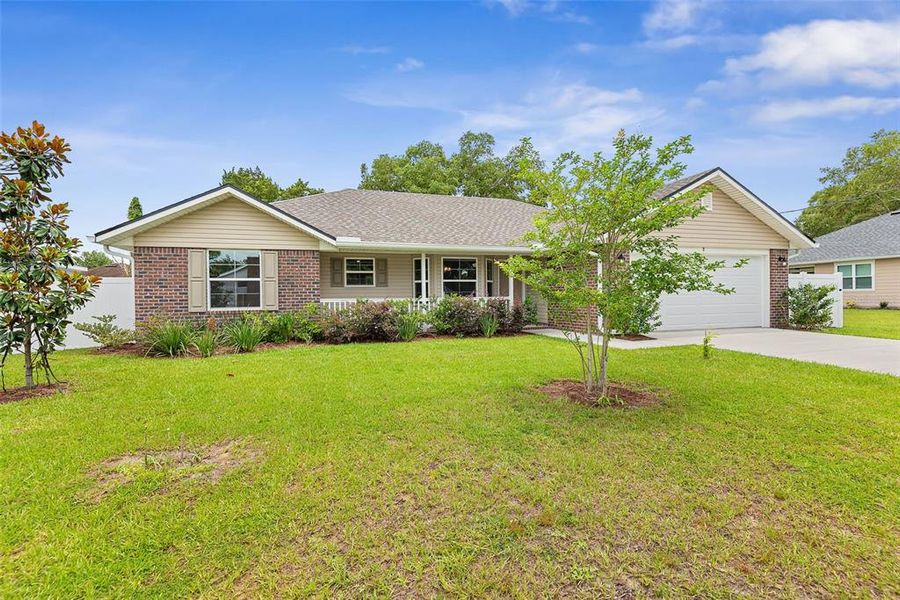 Front exterior of a new home in Palm Coast, Palm Coast, FL, highlighting curb appeal (Image 21).
