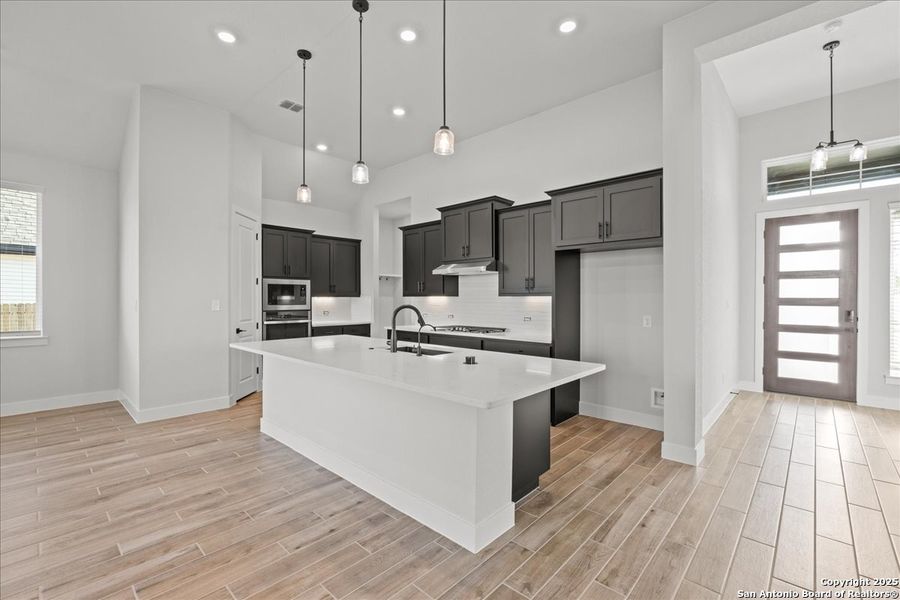 Furnished interior view inside a new home in Village at Three Oaks, Seguin (Image 11).