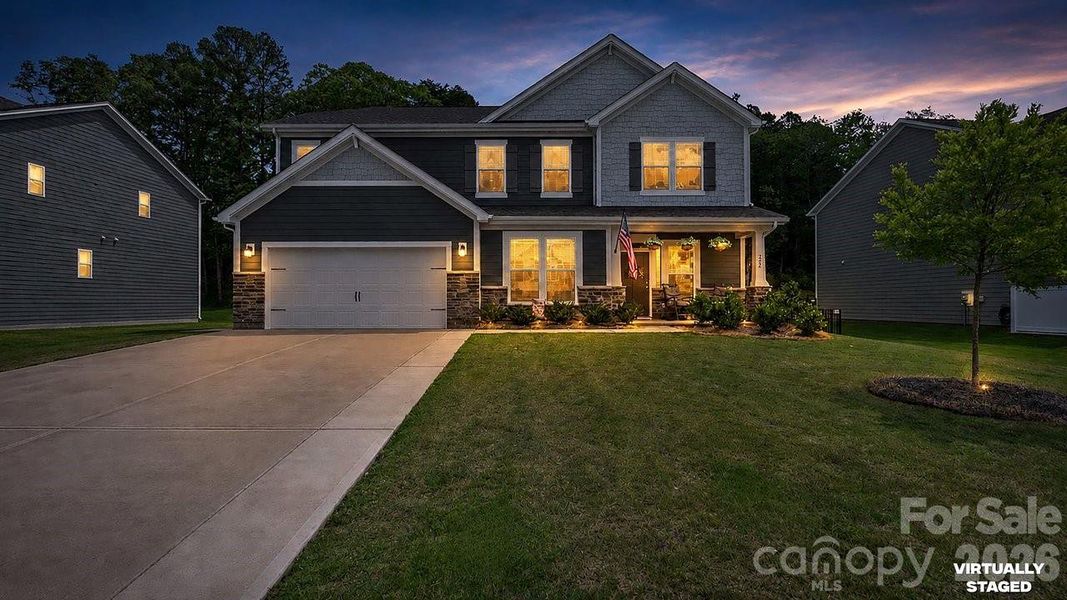 Front exterior of a new home in Sanders Ridge, Troutman, NC, highlighting curb appeal (Image 1). Front exterior of a new home in Sanders Ridge, Troutman, NC, highlighting curb appeal (Image 1).