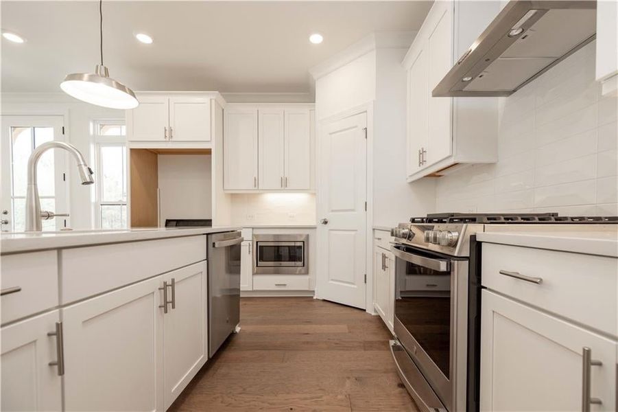 Stainless GE appliances give the kitchen a modern sleek look.