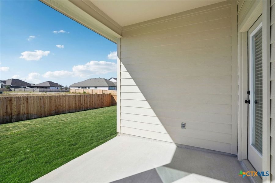 Exterior details and patio area of a home in Village at Three Oaks, Seguin (Image 4).