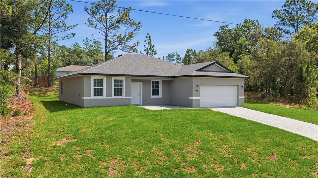Front exterior of a new home in , Citrus Springs, FL, highlighting curb appeal (Image 23). Front exterior of a new home in , Citrus Springs, FL, highlighting curb appeal (Image 23).