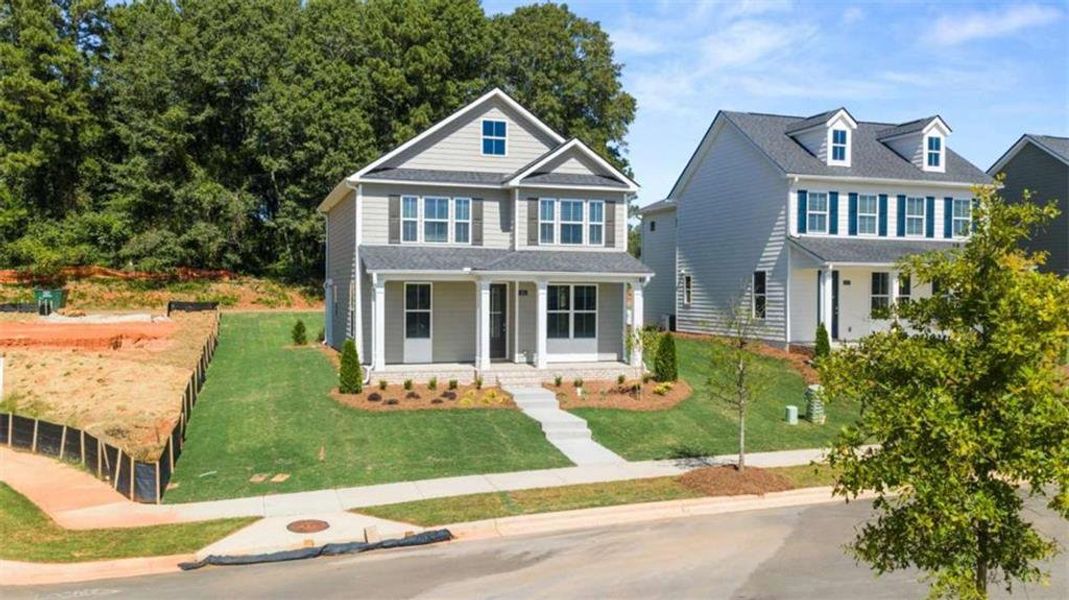 Front exterior of a new home in Brookland Commons, Monroe, GA, highlighting curb appeal (Image 25).