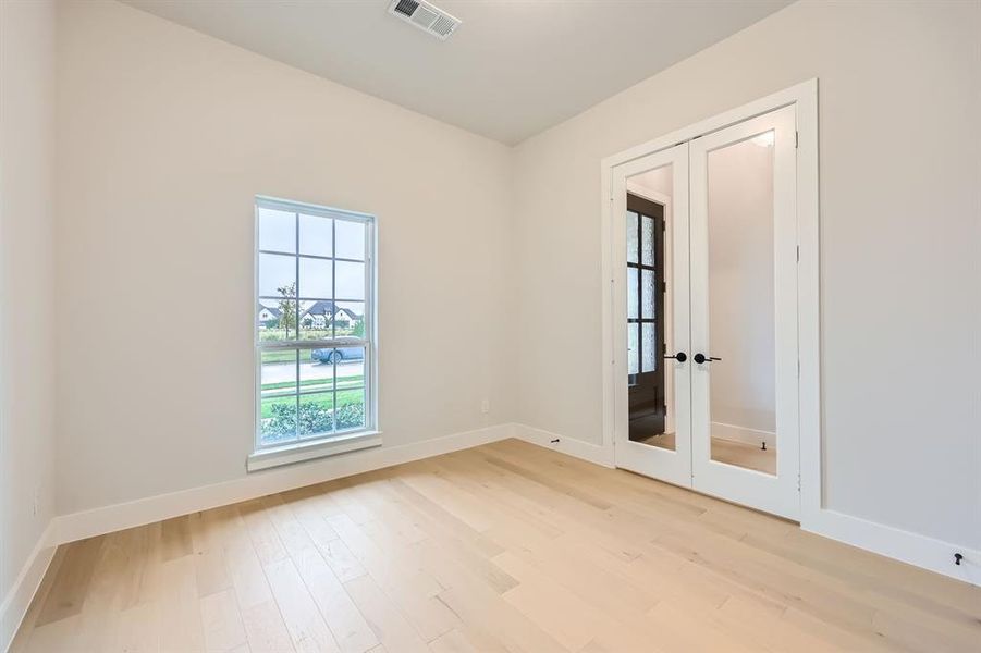 Unfurnished room featuring light hardwood / wood-style flooring