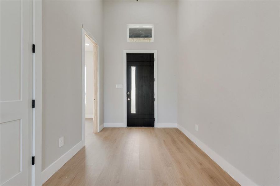 Foyer entrance featuring light hardwood / wood-style floors