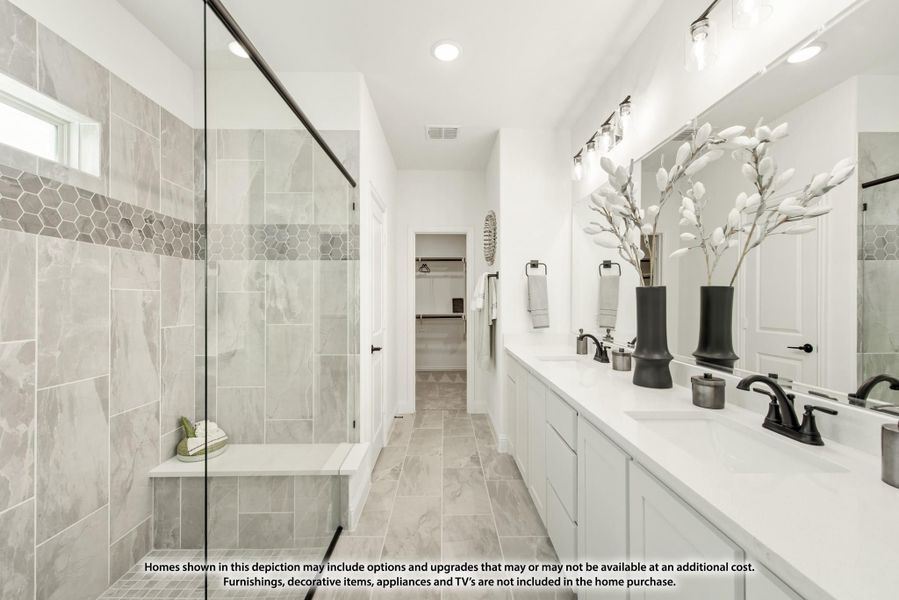 Master bathroom with glass walk-in shower, double vanity, white countertops, and gray tile floors Master bathroom with glass walk-in shower, double vanity, white countertops, and gray tile floors