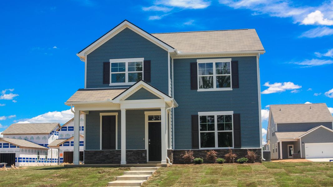 Front exterior of a new home in Percy Cove, Antioch, TN, highlighting curb appeal (Image 1). Front exterior of a new home in Percy Cove, Antioch, TN, highlighting curb appeal (Image 1).