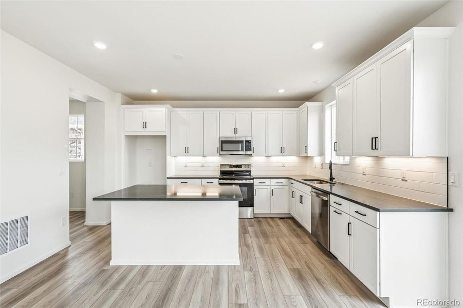 Furnished interior view inside a new home in Windsong, Thornton (Image 8).