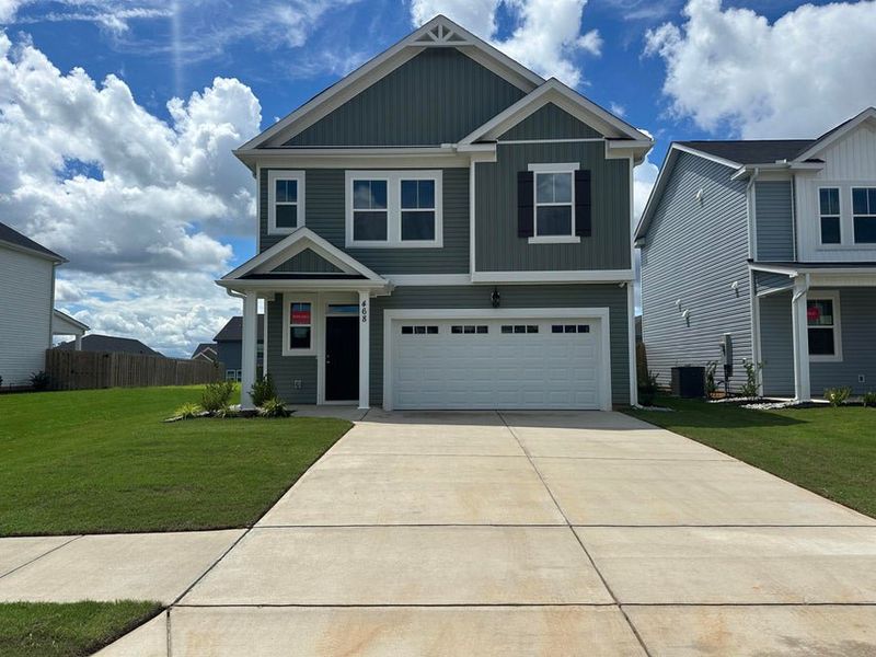 Front exterior of a new home in Windsor, North Augusta, SC, highlighting curb appeal (Image 1). Front exterior of a new home in Windsor, North Augusta, SC, highlighting curb appeal (Image 1).