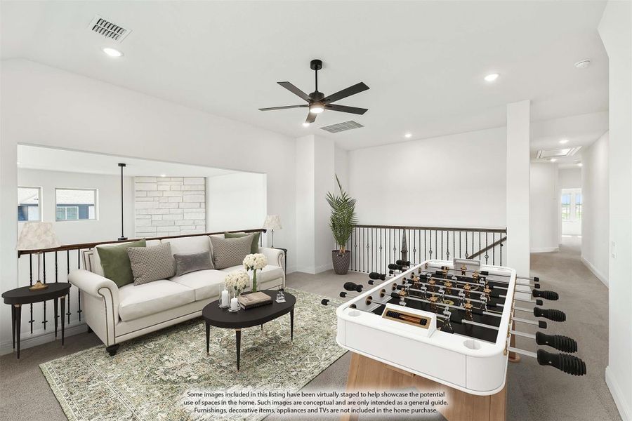 Upstairs loft with sofa, foosball table, ceiling fan, and open stair railing Upstairs loft with sofa, foosball table, ceiling fan, and open stair railing